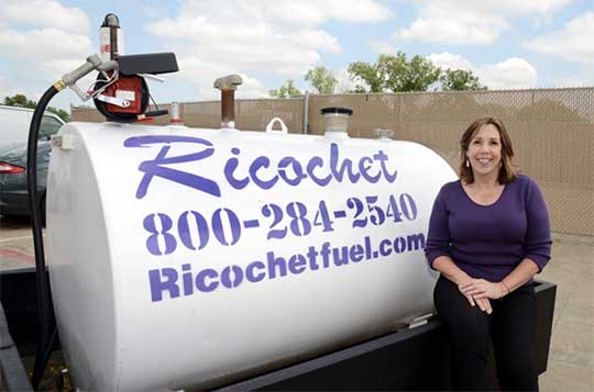 Lady stand in front of fuel tank